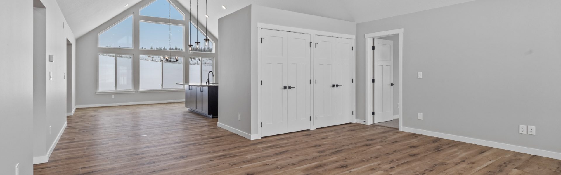 Great Room with Huge Vault and Picture Windows in Custom Summit floor plan by Lexar Homes Spokane